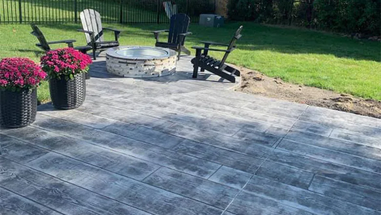 Stamped Concrete Patio with Firepit and Wood Pattern