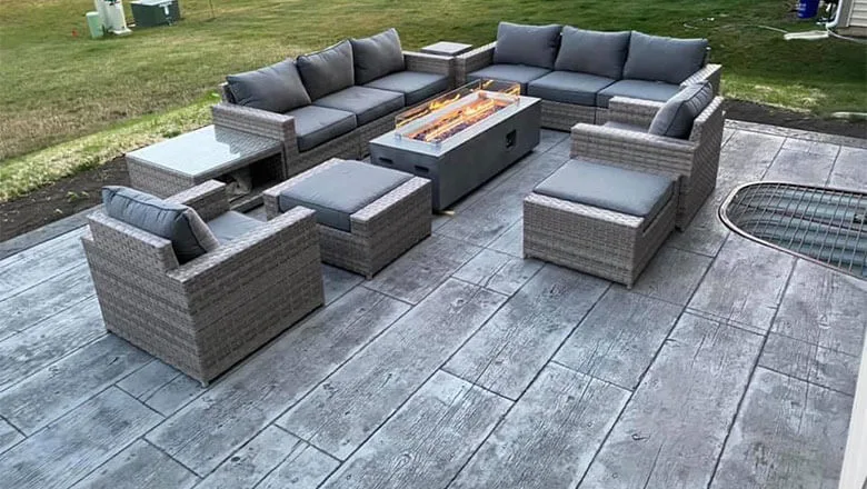 Wood stamped concrete patio with furniture