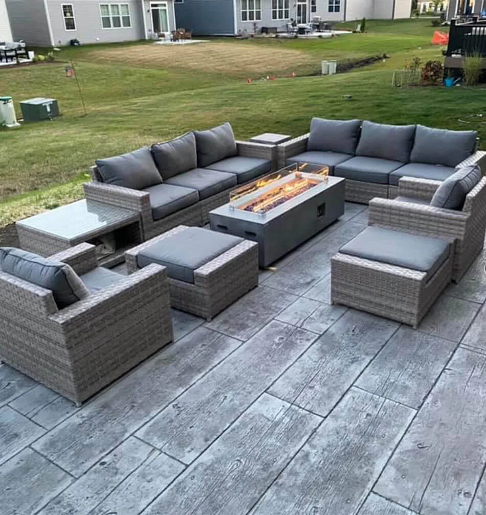 Wood stamped concrete patio with furniture