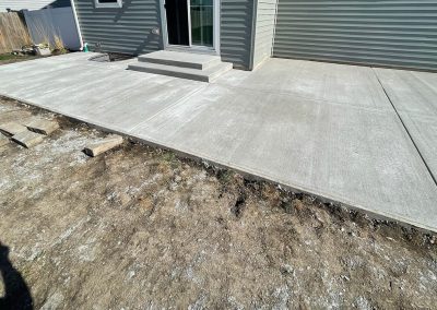 Broom finished concrete patio with steps