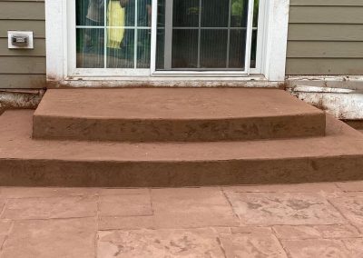Stamped concrete stairs with colored powder release coating